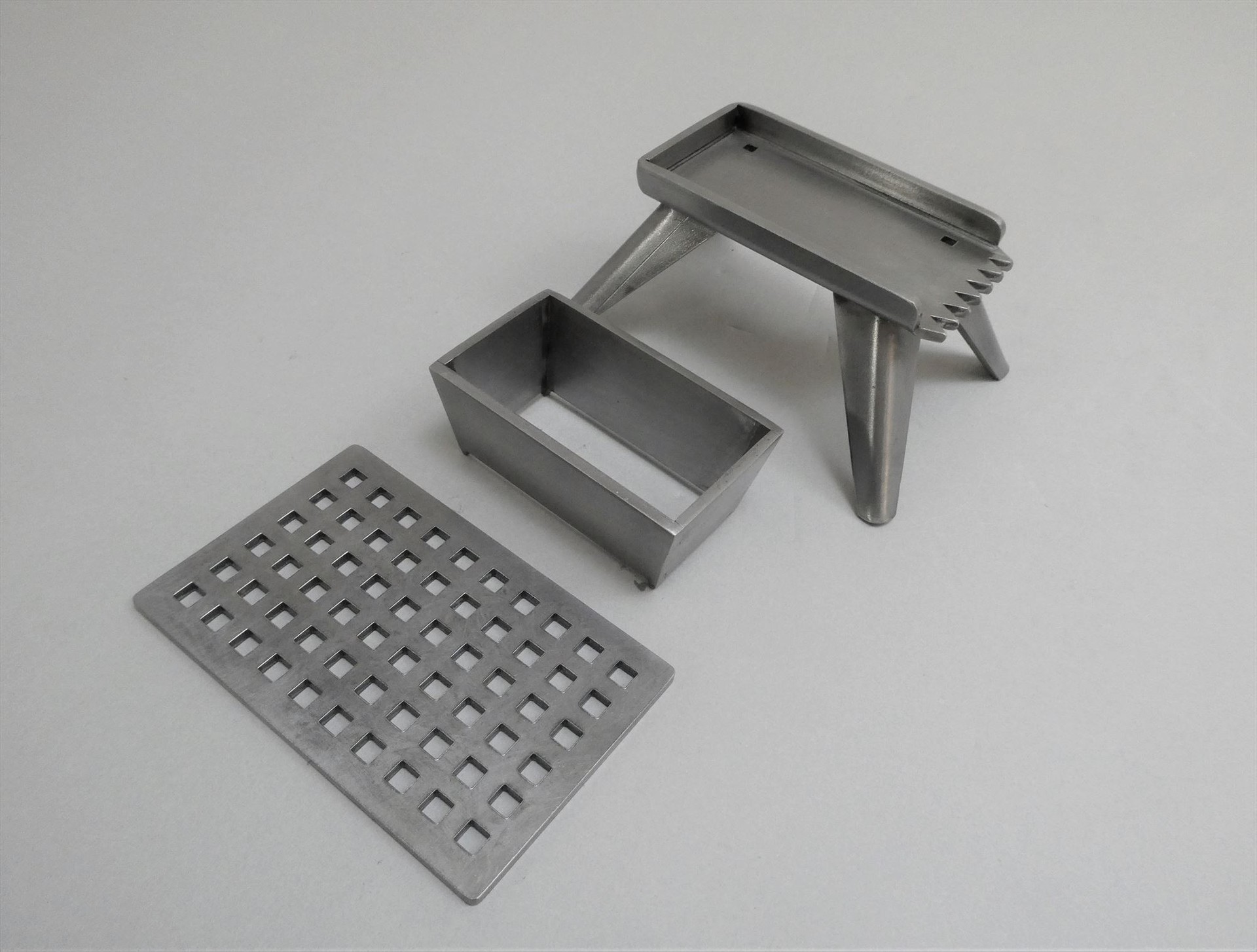 Grill top sheet metal