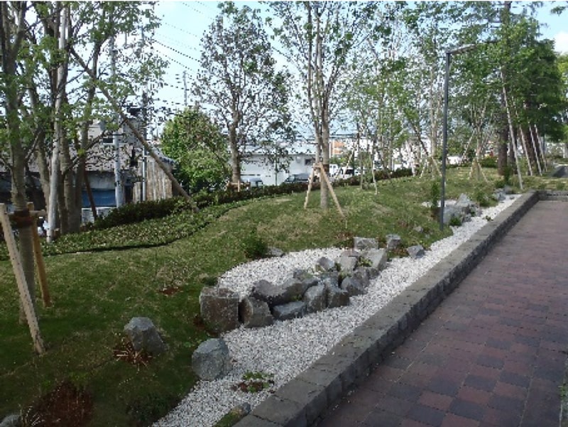 Photo: Permeable planting strip rain garden at Isehara Works