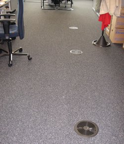 Photo: Air conditioning blowout ducts in the floor of the building of the Amada Solution Center in Haan, Germany
